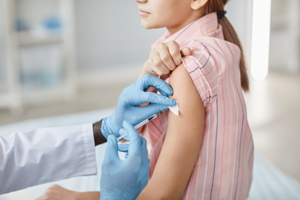 close,up,of,cute,little,girl,getting,vaccinated,in,child