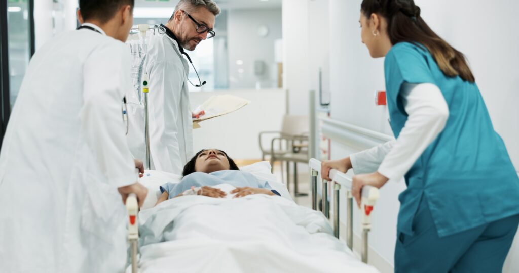 doctors,,patient,and,people,push,hospital,bed,,consulting,and,talking