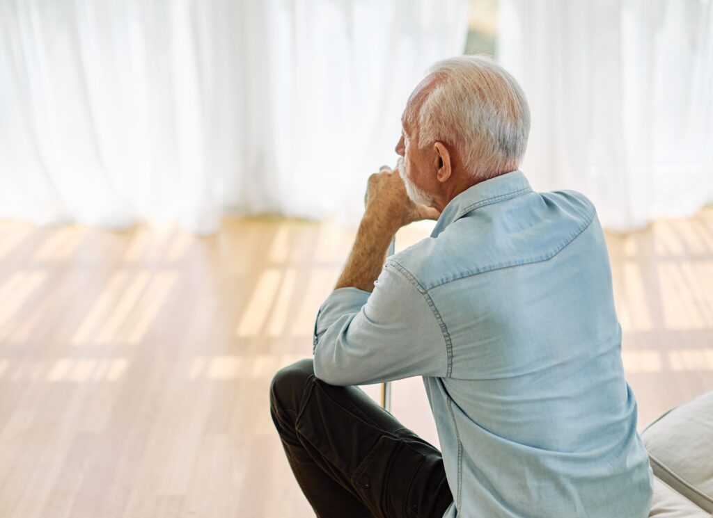portrait,of,a,serious,sad,mature,old,man,at,home