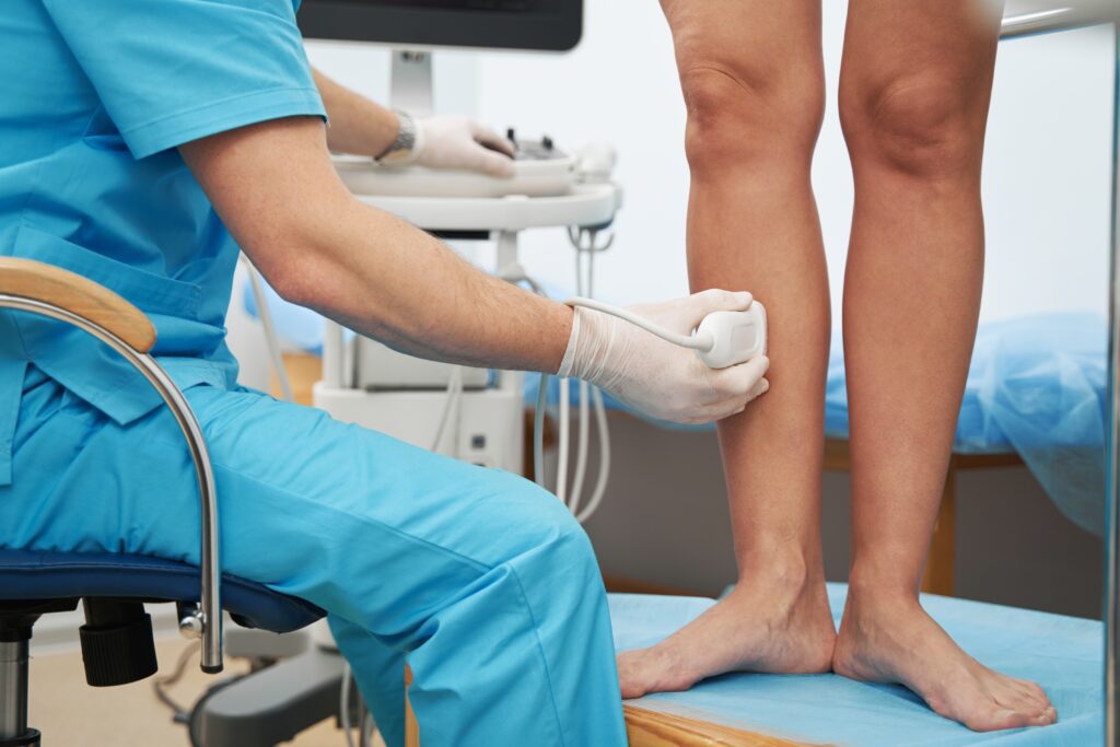 phlebologist,examining,the,condition,of,leg,veins,with,an,ultrasound