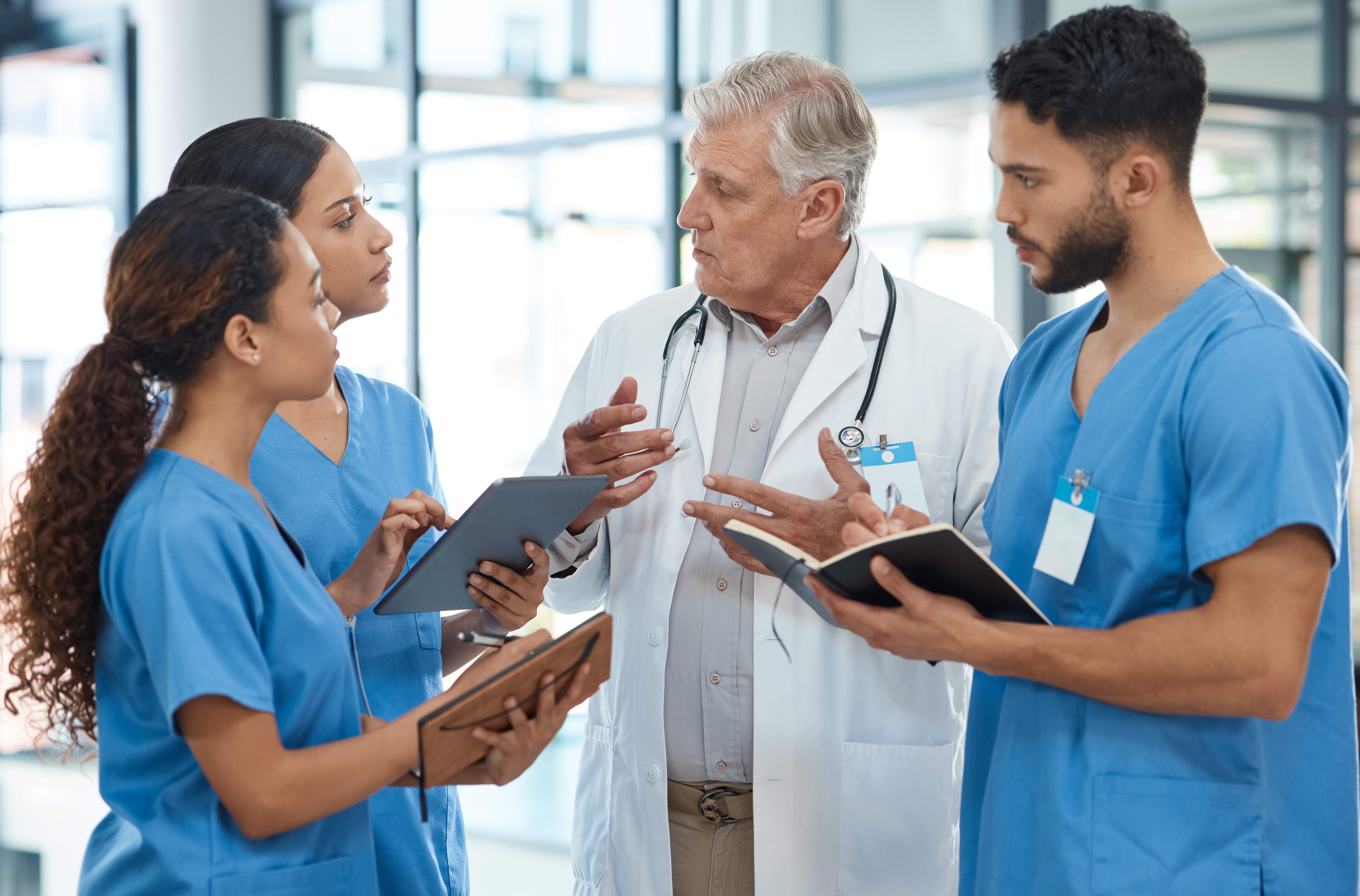 doctor,,people,and,tablet,with,discussion,in,hospital,for,healthcare