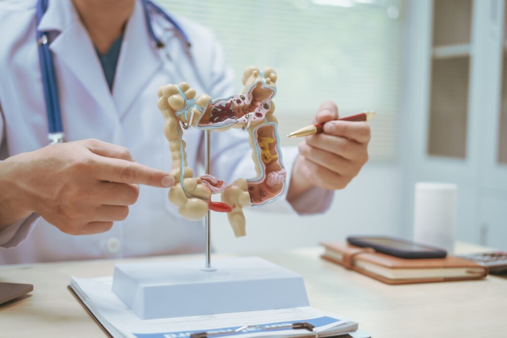 male,doctor,treating,intestinal,diseases,at,a,hospital,table,,discussing