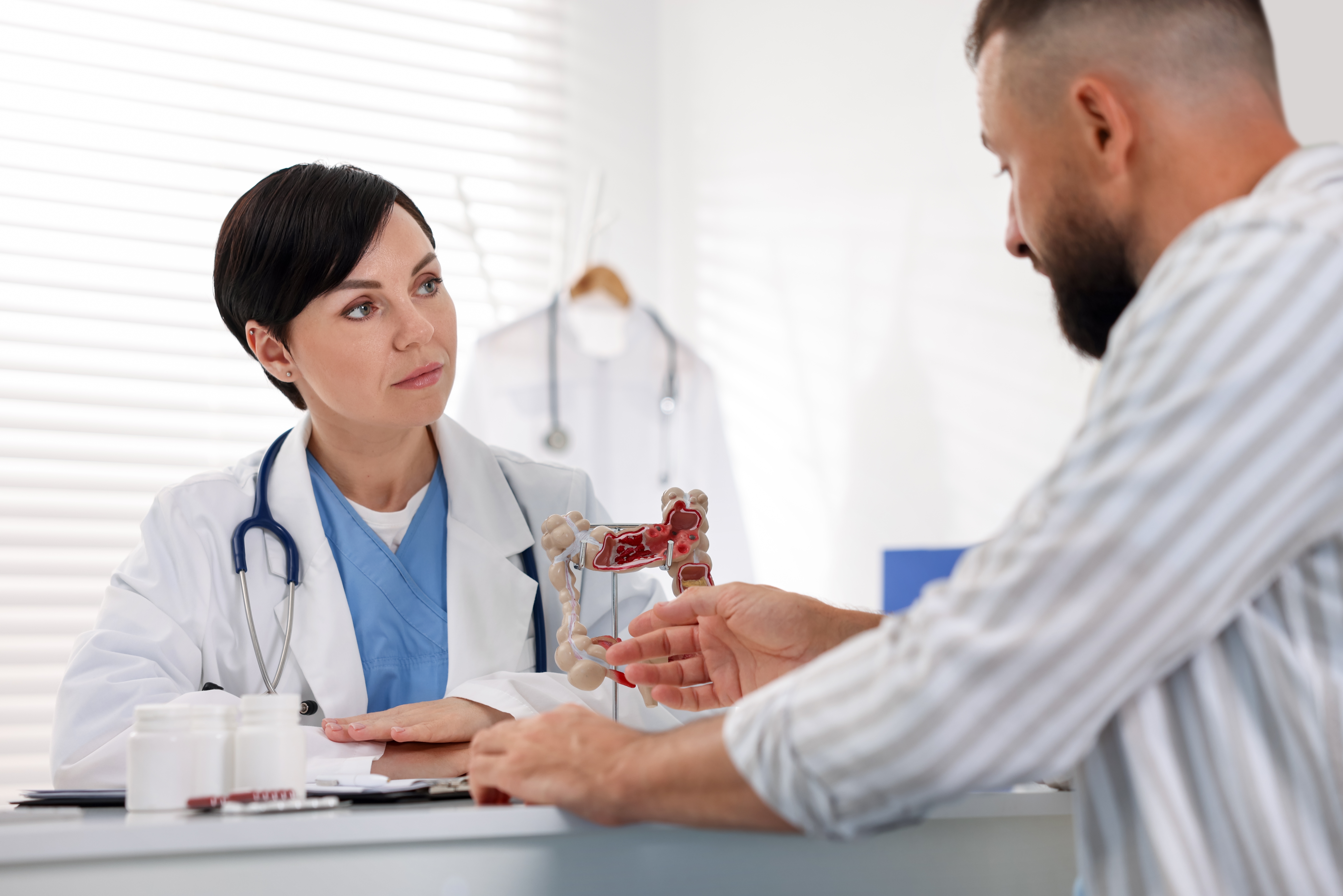 man,having,appointment,with,gastroenterologist,in,clinic