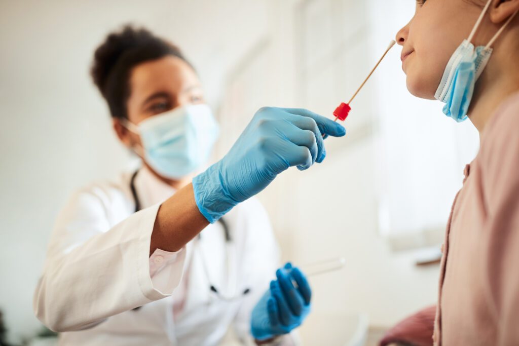 close up,of,little,girl,getting,pcr,test,at,medical,clinic
