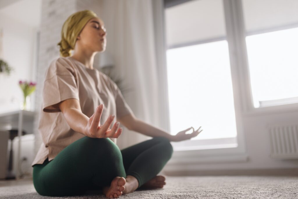 young,woman,with,cancer,taking,yoga,and,meditating,in,her