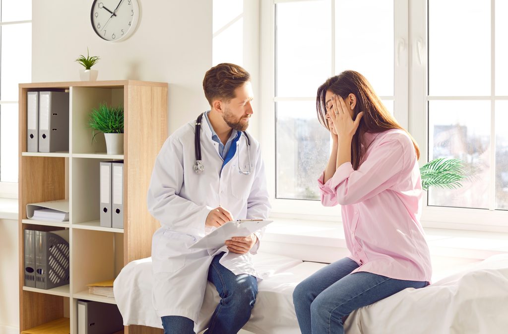 woman,patient,suffering,from,headache,or,migraine,consults,with,a