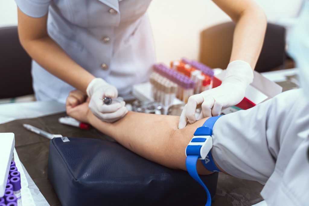 a,nurse,is,taking,a,patient's,blood,test.