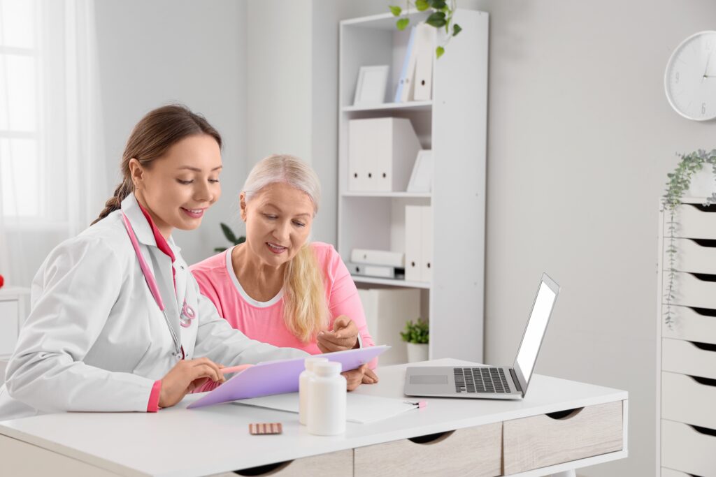 female,doctor,consulting,senior,woman,patient,in,medical,office,,discussing